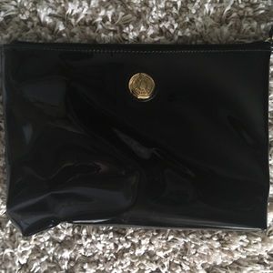 Black patent leather clutch with strap. Used once